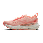 Pink running shoe with white sole on a white background