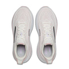 A pair of Brooks running shoes in a light off-white mesh material with subtle pink accents on the collar lining and heel edges, shown from a top-down view on a white background.