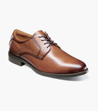 Brown leather dress shoe on a white background