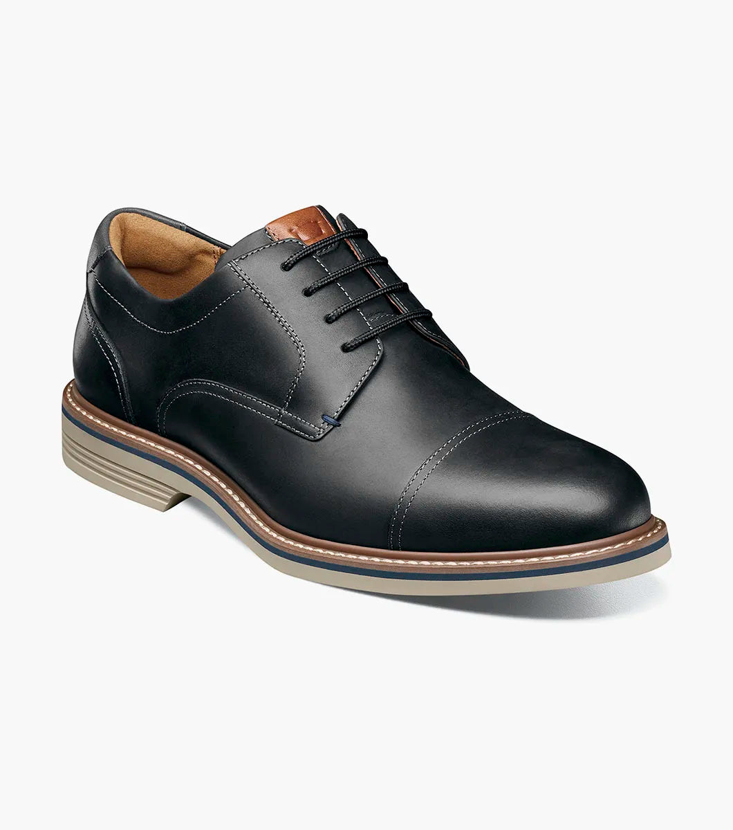 Black leather dress shoe on a white background