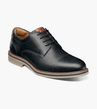 Black leather dress shoe on a white background