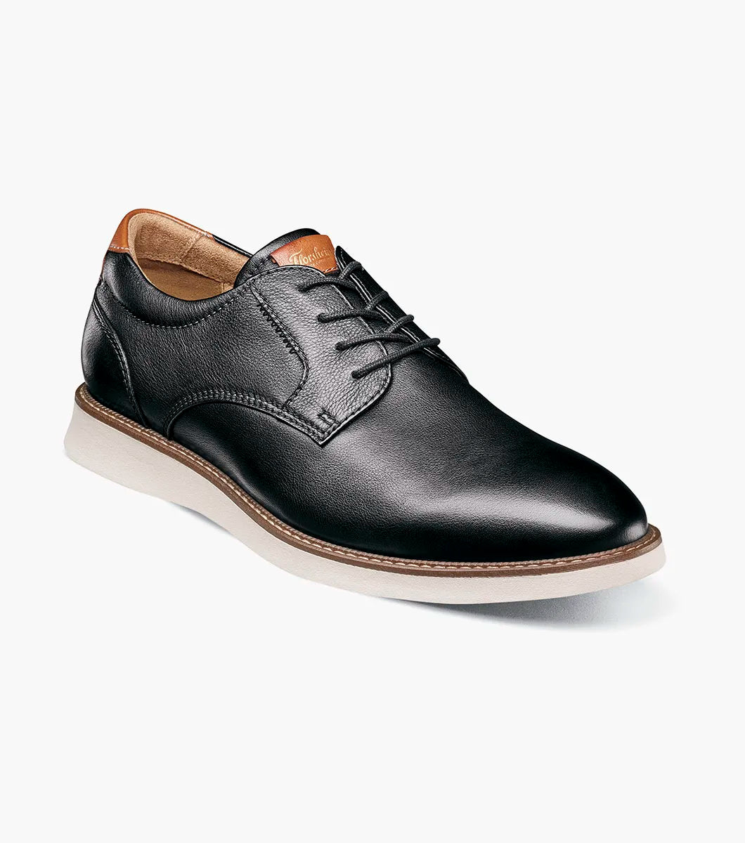 Brown leather shoe on a white background