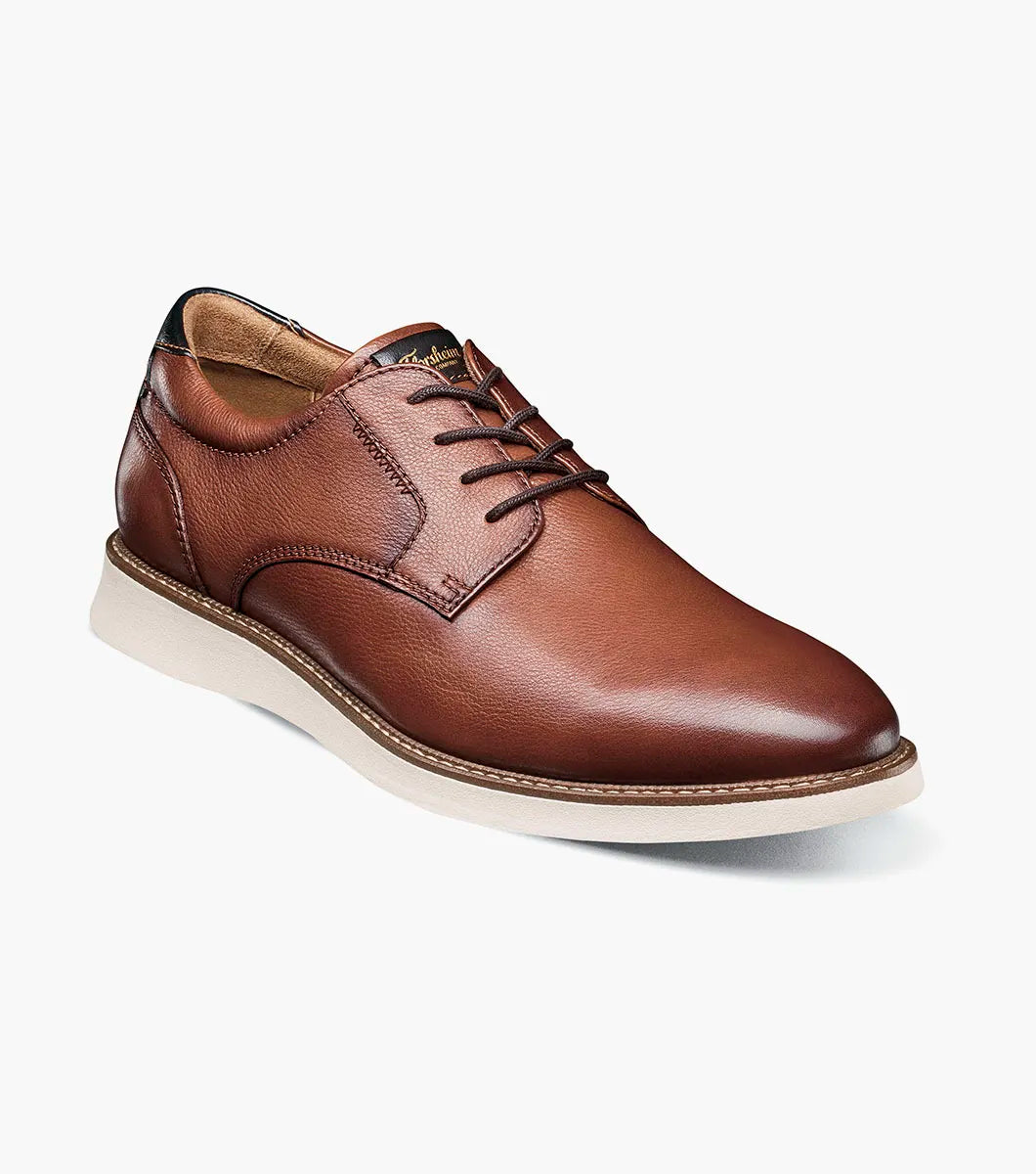 Brown leather shoe on a white background