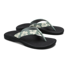 Pair of black sandals with floral straps on a white background