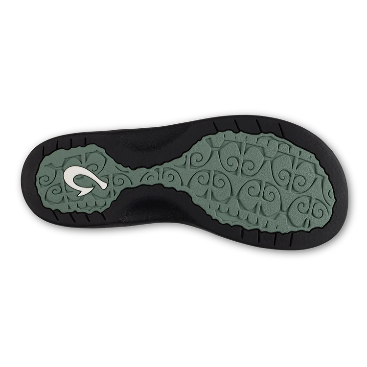 Close-up of a shoe sole with a brand logo on a white background
