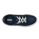 Navy blue sneaker with white laces on a white background