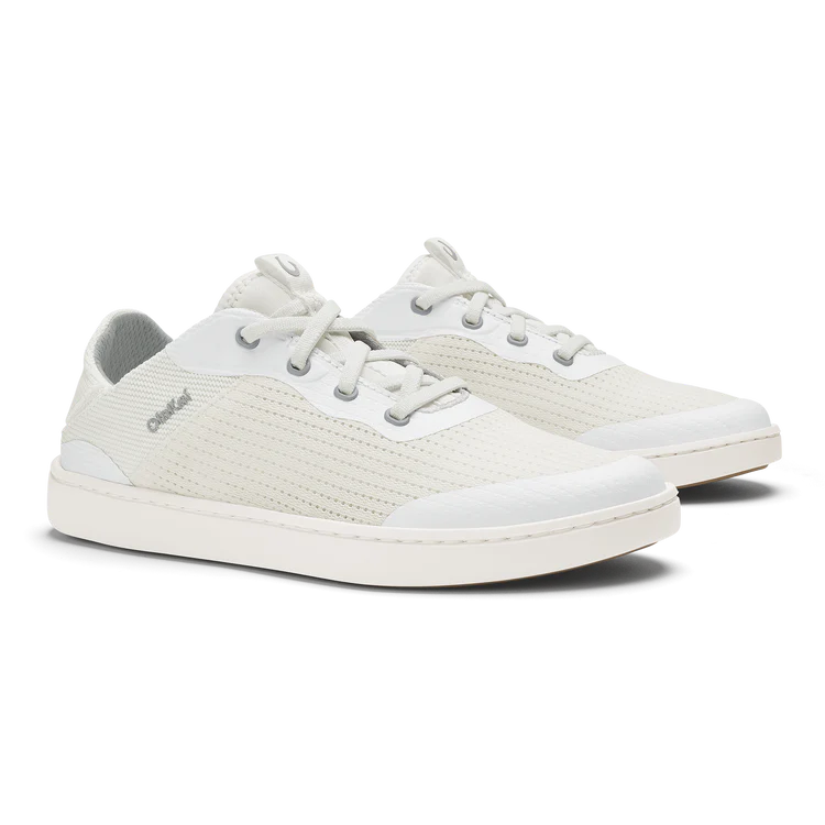 Pair of white sneakers on a white background