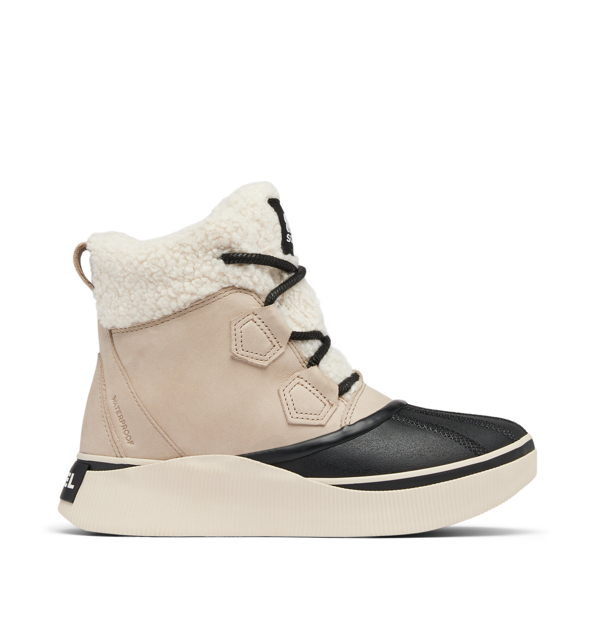 A mid-height winter boot in beige suede and black leather, featuring a thick cream-colored platform sole, black laces, and a plush cream sherpa lining.