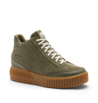 An olive green high-top sneaker by Koffi, featuring a suede-like upper, white braided laces, and a chunky brown gum sole with a textured chevron pattern.