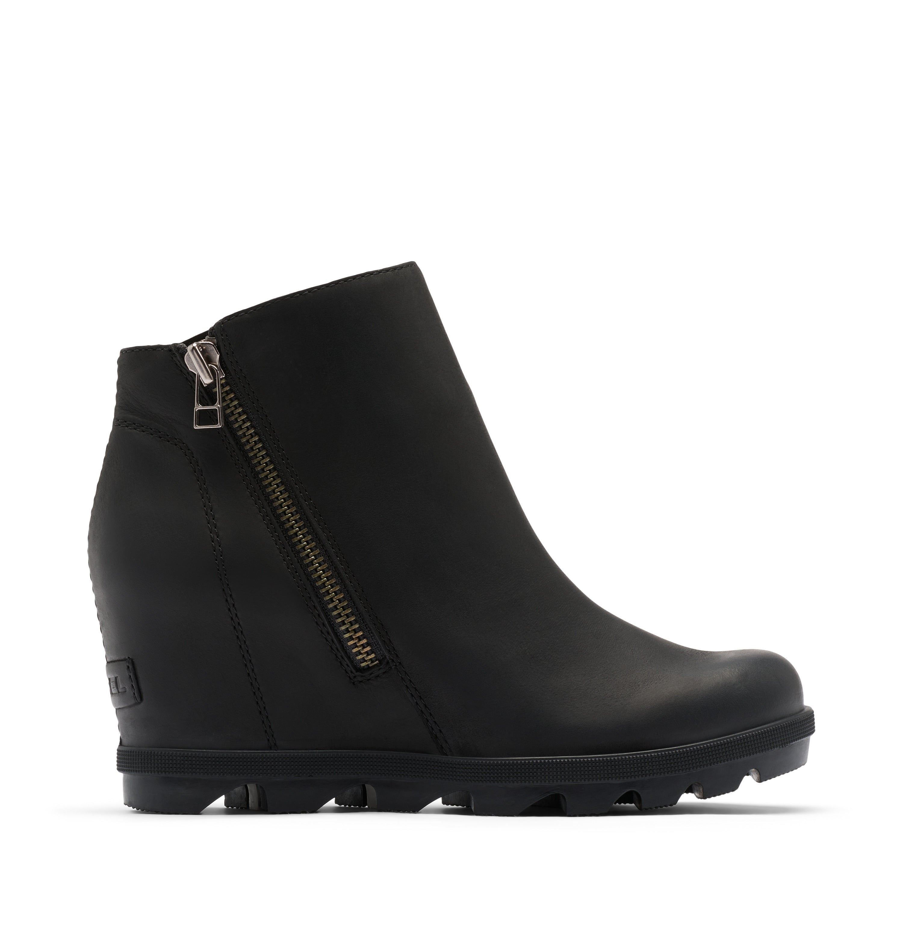 A black leather ankle boot with a side zipper, wedge heel, and chunky lug sole, shown from a side profile on a light beige background.