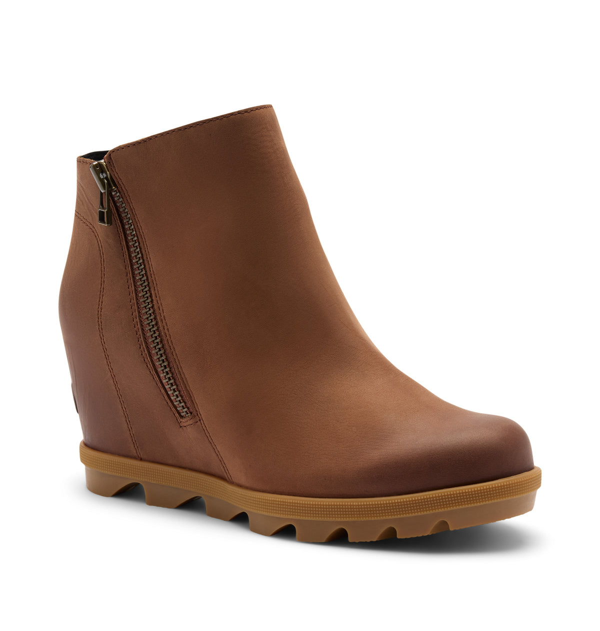 A brown leather wedge ankle boot with a side zipper and a chunky lug sole, shown from a three-quarters angle on a light beige background.