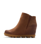 A single brown leather ankle boot with a wedge heel and a thick lug sole, shown in profile against a white background.
