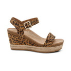 Leopard print wedge sandal with a jute sole on a white background