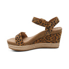 Leopard print wedge sandal with jute sole on a white background