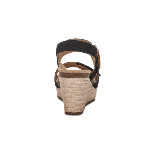 Wedge sandal with espadrille sole on a white background