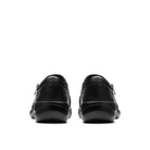 A pair of black leather slip-on shoes shown from the back, positioned side-by-side against a solid white background.