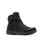 A black leather ankle boot with a side buckle strap, shown from a three-quarters angle on a white background.