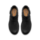 A pair of black leather ankle boots with side buckle straps, shown from a top-down view on a white background. The insoles show the brand 'Clarks Collection'.