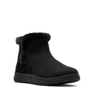 A single black ankle boot with a plush black faux-fur trim at the collar, shown from a three-quarters angle on a white background.