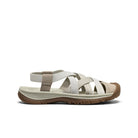 Beige sandal with brown sole on a white background