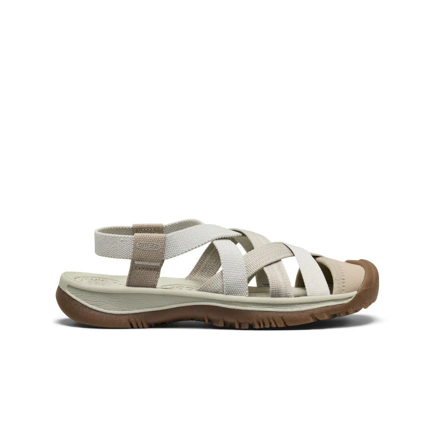 Beige sandal with brown sole on a white background