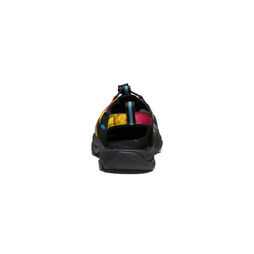 Black sandal with colorful accents on a white background