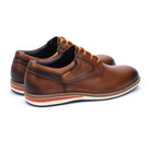Brown leather shoes with orange accents on a white background