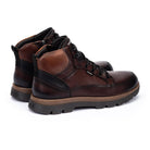A pair of men's mid-calf boots in dark brown leather with black accents, black laces, and a rugged black and brown sole, shown on a white background.