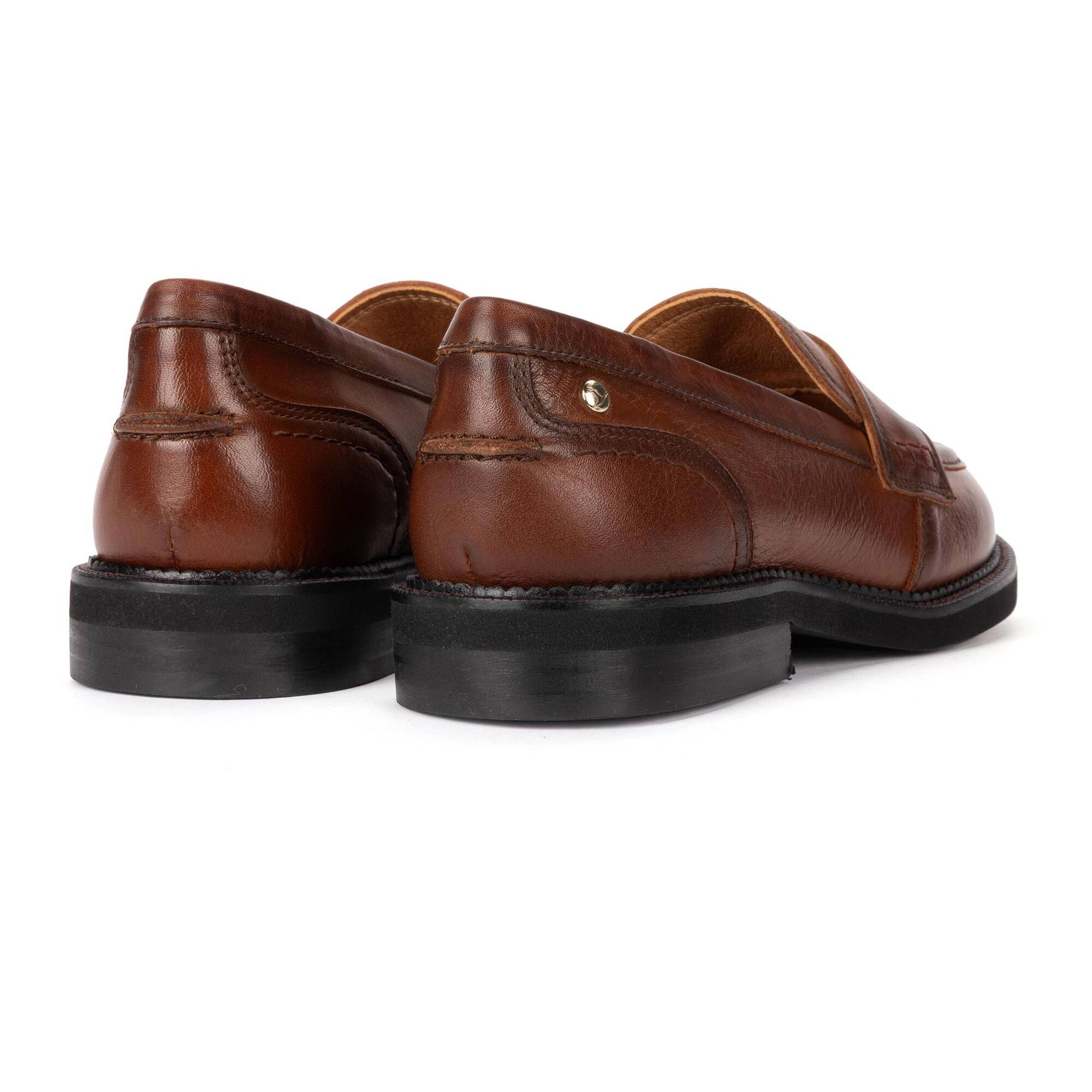 A pair of brown leather slip-on loafers with black soles, shown from a rear three-quarter angle on a white background.