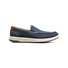 Navy blue loafer shoe with brown accents on a white background