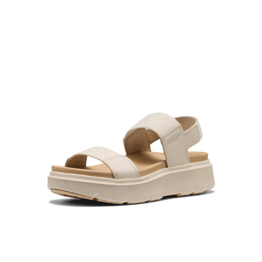 Beige sandal with a platform sole on a white background