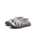 Pair of gray and purple sandals on a white background
