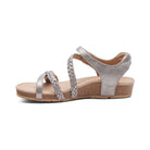 Silver sandal with braided straps on a white background