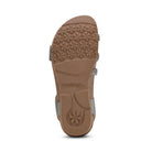 Brown sandal sole with 'aetrex' branding on a white background