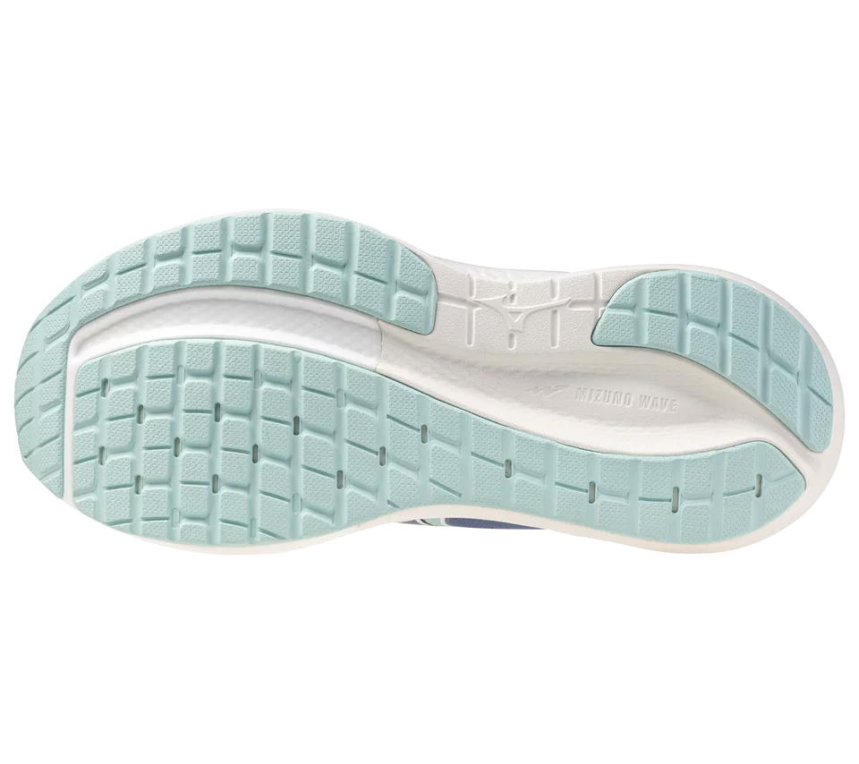 Close-up of a shoe sole with light blue tread pattern on a white background