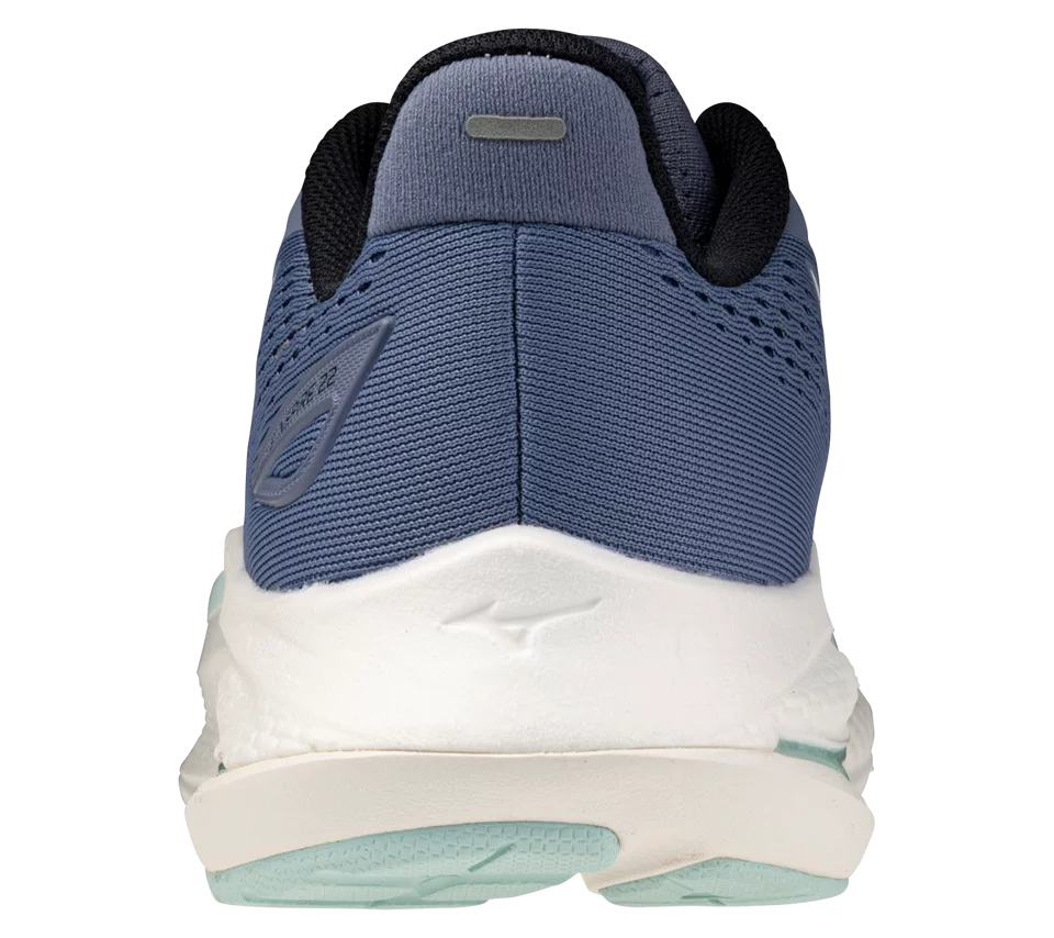 Blue and white athletic shoe with a visible brand logo on a white background