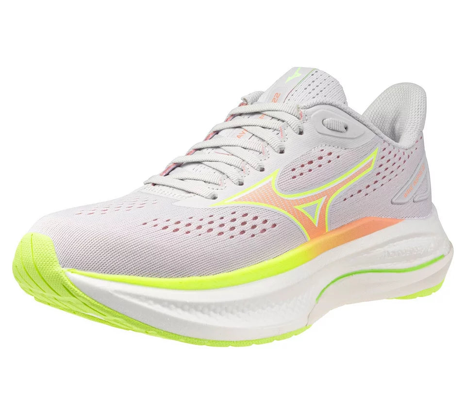 Gray running shoe with green sole on a white background