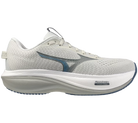 White running shoe with pink sole on a white background