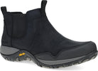 A black Chelsea-style ankle boot with a textured suede-like upper, elastic side gore, and a rugged black sole with a small yellow Vibram logo, shown on a white background.