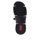 Black sole of a shoe with a red brand logo on a white background