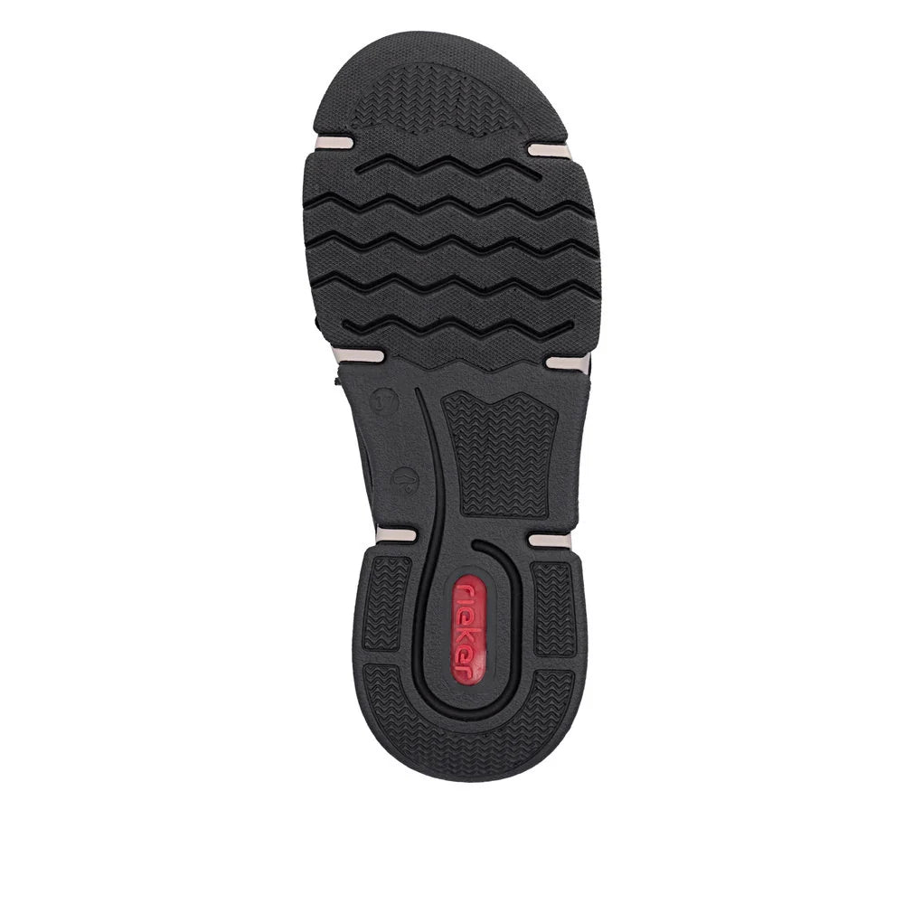Black shoe sole with textured pattern on a white background