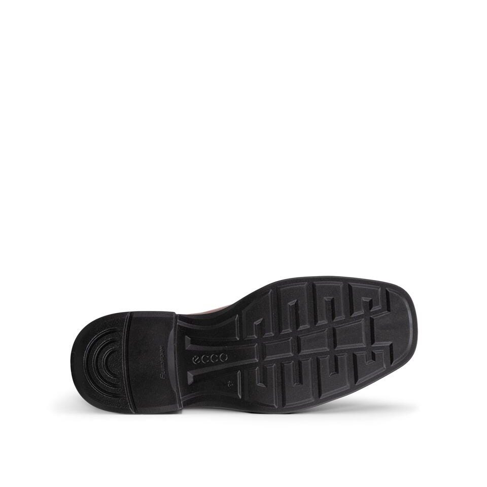The black rubber outsole of a shoe, showing the tread pattern and embossed ECCO brand logo, photographed from a bottom angle on a white background.