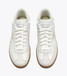 White sneakers with brown soles on a white background