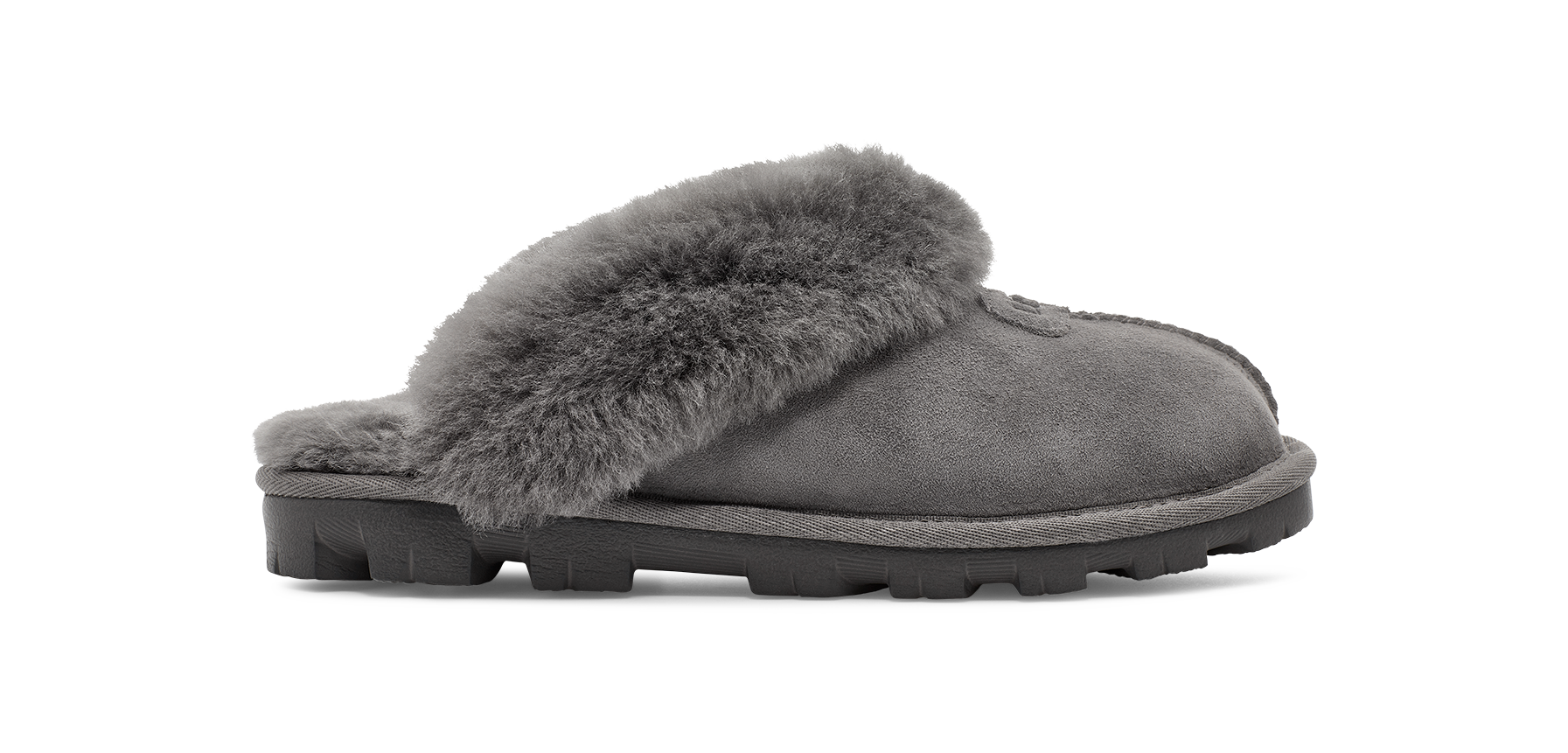 A single gray suede slipper with a thick gray faux-fur collar and a black lug sole, shown in profile against a white background.