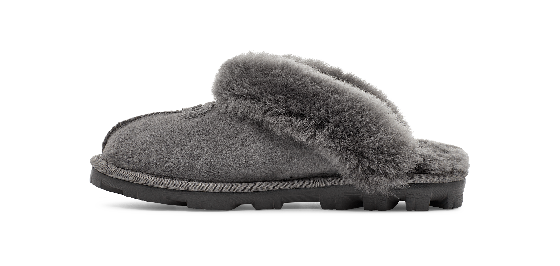 A single gray suede slipper with a thick gray faux-fur collar and a black sole, shown in profile against a white background.