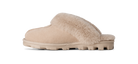 A single slip-on mule slipper in beige suede with a soft beige faux-fur collar and a chunky lug sole, shown in profile against a white background.