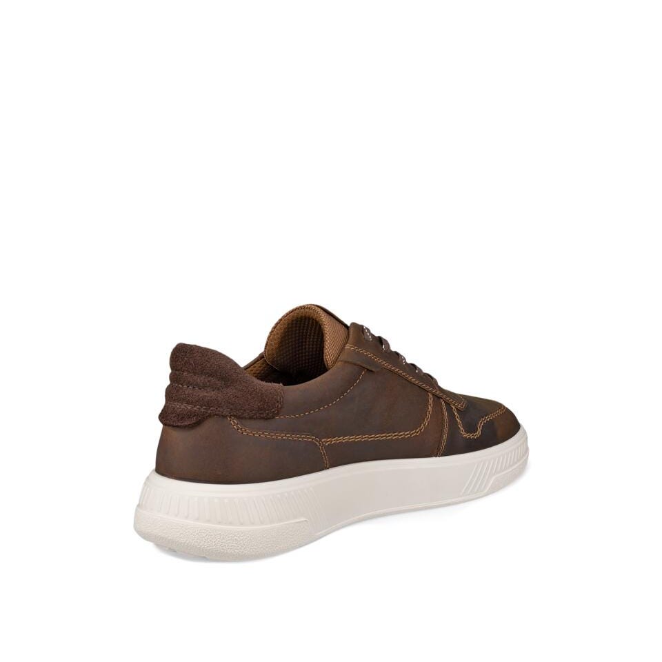 Brown sneaker with white sole on a white background