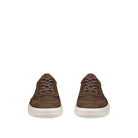 A pair of low-top brown leather sneakers shown from the front on a solid white background.