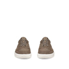 Pair of brown suede sneakers on a white background