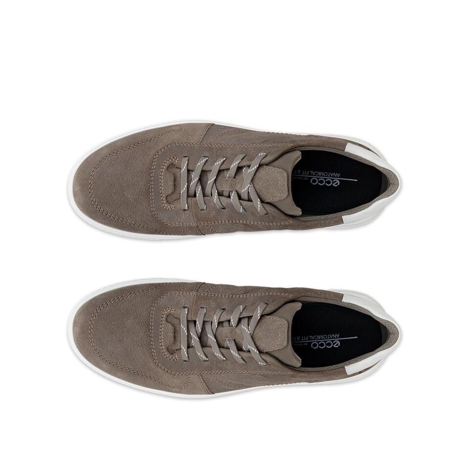 Pair of brown sneakers on a white background